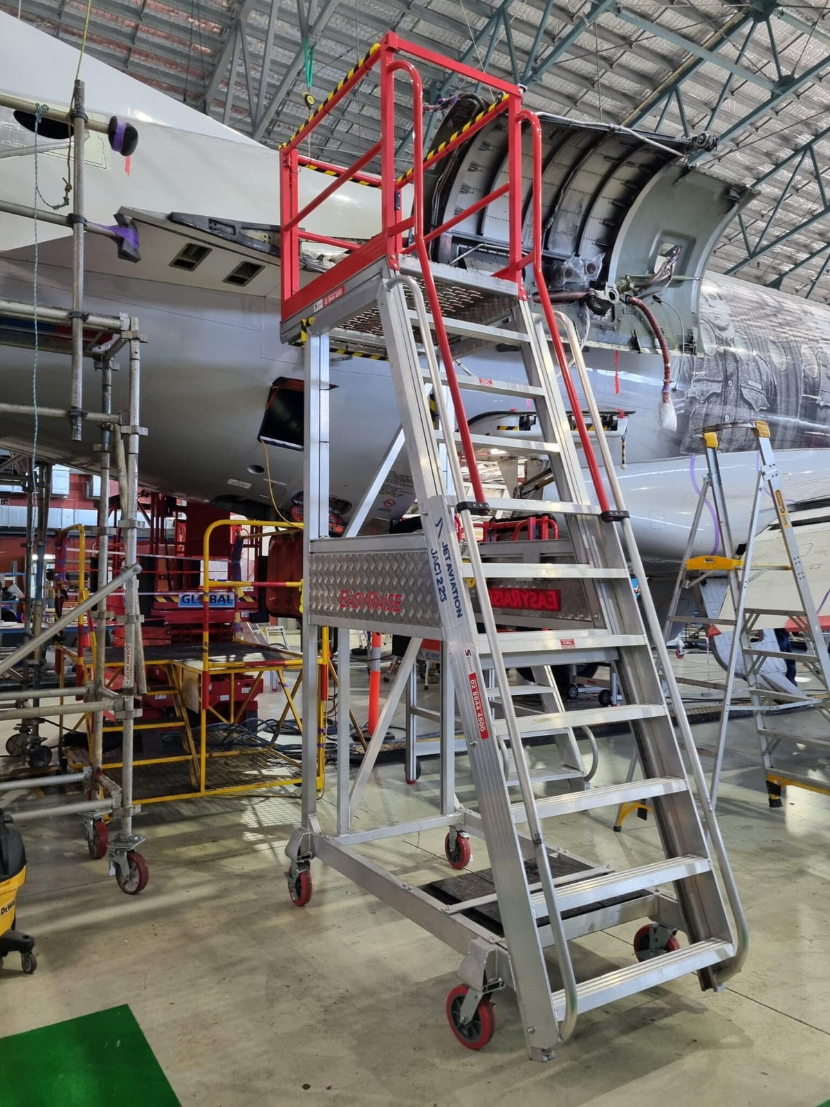 Core Engineering Depot EasyRaise mobile access steps with platform, safety equipment for secure height access, shown in the image.