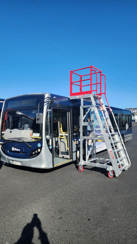 Core Engineering Depot EasyRaise mobile access steps with platform, safety stairs for secure building access, shown in kinetic bus setting.