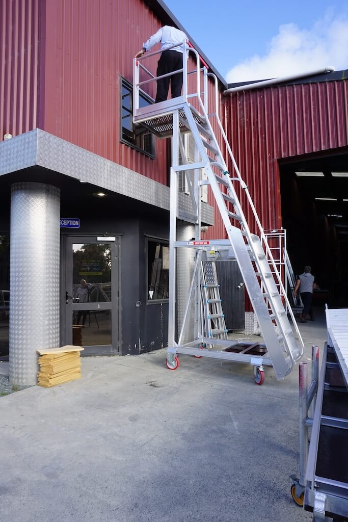Core Engineering Depot EasyRaise mobile access steps with platform for safe height access in industrial or construction settings.