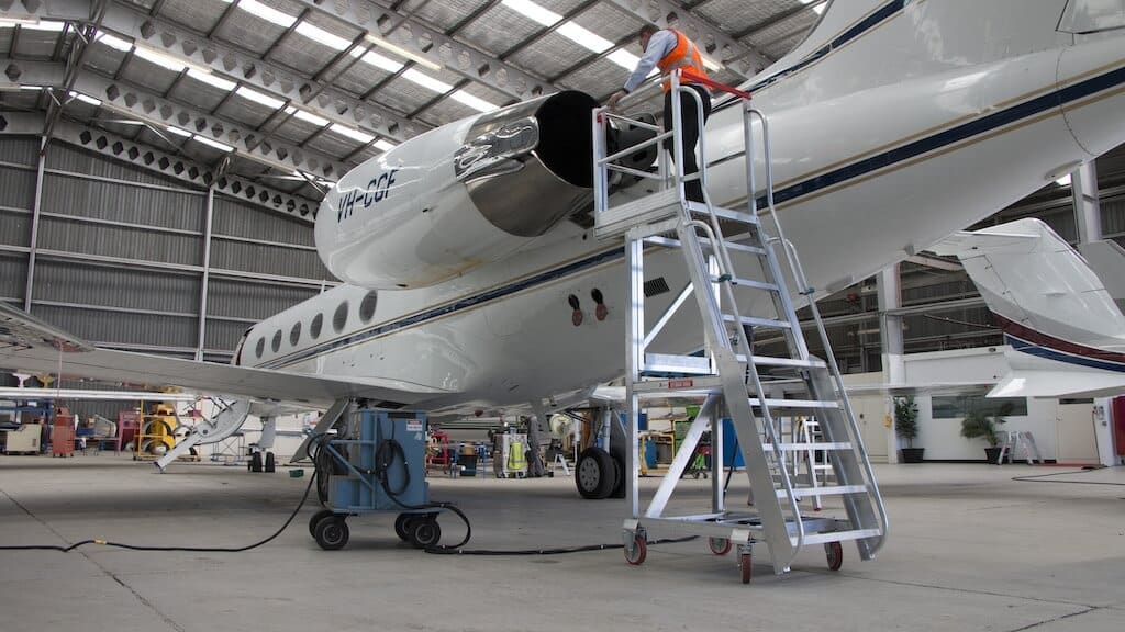 Core Engineering Depot EasyRaise mobile access steps with platform, safety equipment for secure elevated work.